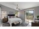 Serene main bedroom featuring a sliding glass door leading to a private balcony at 10329 E Star Of The Desert Dr, Scottsdale, AZ 85255