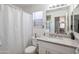 Clean bathroom with stylish mirror and a shower with tub next to it at 10951 E Delta Ave, Mesa, AZ 85208