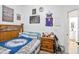 Bedroom with wooden furniture, carpet flooring, neutral walls, and Laker's memorabilia at 10951 E Delta Ave, Mesa, AZ 85208
