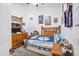 Bedroom with wooden furniture, neutral walls, carpet flooring, and fan at 10951 E Delta Ave, Mesa, AZ 85208
