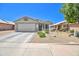 Beautiful single-story home featuring desert landscaping and a two-car garage at 10951 E Delta Ave, Mesa, AZ 85208