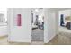 Hallway leading to bedroom showcasing light colored walls and flooring at 10951 E Delta Ave, Mesa, AZ 85208