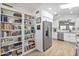 Spacious kitchen featuring white cabinetry, stainless steel appliances, and ample storage at 10951 E Delta Ave, Mesa, AZ 85208