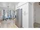 Bright kitchenette area with stainless steel refrigerator and adjacent dining space at 10951 E Delta Ave, Mesa, AZ 85208