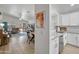 Open-concept design with a view of the modern kitchen and spacious living area at 10951 E Delta Ave, Mesa, AZ 85208
