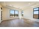 Light-filled bedroom showcasing wood floors, modern windows, and ample natural light at 13290 E La Junta Rd, Scottsdale, AZ 85255