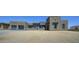Contemporary home showcasing a blend of stucco and stone, complemented by a clean, modern driveway at 13290 E La Junta Rd, Scottsdale, AZ 85255