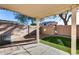 Backyard patio with artificial turf and privacy wall, perfect for outdoor entertaining at 13585 N 87Th Dr, Peoria, AZ 85381
