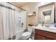 Full bathroom featuring a shower and tub combination, a toilet, and a vanity with cabinet space at 13585 N 87Th Dr, Peoria, AZ 85381