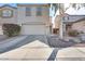 Well-maintained two-story home featuring a two-car garage and neutral stucco exterior at 13585 N 87Th Dr, Peoria, AZ 85381