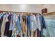 Spacious walk-in closet with clothing rack and storage space at 13585 N 87Th Dr, Peoria, AZ 85381