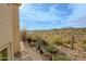 Spacious backyard with desert landscaping, wrought iron fencing and distant mountain views at 14850 E Grandview Dr # 138, Fountain Hills, AZ 85268