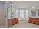 Bright bathroom with a soaking tub, double vanity, and glass shower, all bathed in natural light at 14850 E Grandview Dr # 138, Fountain Hills, AZ 85268