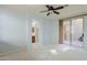 Large bedroom with a sliding door leading to a balcony, offering natural light and outdoor access at 14850 E Grandview Dr # 138, Fountain Hills, AZ 85268
