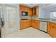 Kitchen with wood cabinets, stainless steel appliances, and tile backsplash at 14850 E Grandview Dr # 138, Fountain Hills, AZ 85268