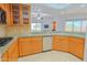Efficient kitchen featuring wood cabinetry, granite countertops, and modern appliances at 14850 E Grandview Dr # 138, Fountain Hills, AZ 85268