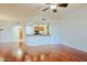 Open living room with hardwood floors and a view of the kitchen at 14850 E Grandview Dr # 138, Fountain Hills, AZ 85268