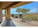 Covered patio with brick flooring, iron railing, and stunning views of the surrounding landscape at 14850 E Grandview Dr # 138, Fountain Hills, AZ 85268
