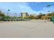 A serene tennis court features a smooth surface and well-maintained net, perfect for recreational games in a peaceful setting at 14850 E Grandview Dr # 138, Fountain Hills, AZ 85268