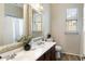 Bathroom featuring a double sink vanity, modern lighting and bright mirrors at 15105 W Glenrosa Ave, Goodyear, AZ 85395