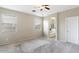 Carpeted bedroom with natural light; neutral colors and plenty of open space at 15105 W Glenrosa Ave, Goodyear, AZ 85395