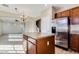Well-designed kitchen island, stainless steel appliances, and open layout to living area at 15105 W Glenrosa Ave, Goodyear, AZ 85395