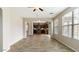 Bright living room features wood flooring and open concept design to the kitchen at 15105 W Glenrosa Ave, Goodyear, AZ 85395