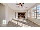 Open-concept living area with tile floors seamlessly connecting to the kitchen at 15105 W Glenrosa Ave, Goodyear, AZ 85395