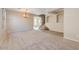 Bright living room featuring neutral carpet, staircase access, and recessed lighting at 15105 W Glenrosa Ave, Goodyear, AZ 85395
