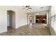 Bright living room features wood flooring and open concept design to the kitchen at 15105 W Glenrosa Ave, Goodyear, AZ 85395