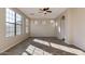 Inviting living room with tile flooring, large windows, and abundant natural light at 15105 W Glenrosa Ave, Goodyear, AZ 85395