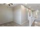 Spacious carpeted loft area with natural lighting and a railing at 15105 W Glenrosa Ave, Goodyear, AZ 85395