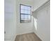 This walk-in closet features a window and shelving, offering ample storage space at 15105 W Glenrosa Ave, Goodyear, AZ 85395