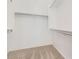 This walk-in closet offers ample storage space with shelving, ensuring organization for your wardrobe at 15105 W Glenrosa Ave, Goodyear, AZ 85395