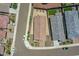 Aerial view shows a backyard, neighboring houses, and street in a suburban neighborhood at 15817 S 177Th Dr, Goodyear, AZ 85338