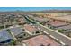Planned community showcasing a peaceful streetscape with varied rooflines, lush landscaping, and views of the desert terrain at 15817 S 177Th Dr, Goodyear, AZ 85338