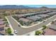 Scenic aerial view of a vibrant neighborhood with stunning mountain backdrop, offering a peaceful desert living experience at 15817 S 177Th Dr, Goodyear, AZ 85338