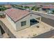 Aerial view of a backyard with a covered patio and block fence in a desert community at 15817 S 177Th Dr, Goodyear, AZ 85338