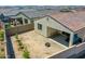 Aerial view of a backyard with a covered patio with furniture and gravel landscaping at 15817 S 177Th Dr, Goodyear, AZ 85338