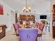 Open concept dining area with seating for six and seamless flow to the kitchen area at 15817 S 177Th Dr, Goodyear, AZ 85338