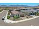 Charming single-story home featuring a well-maintained front yard and inviting brick-paved driveway, perfect for Gathering living at 15817 S 177Th Dr, Goodyear, AZ 85338
