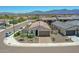 Inviting single-Gathering home featuring manicured desert landscaping, an attached two-car garage, and scenic mountain views at 15817 S 177Th Dr, Goodyear, AZ 85338