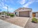Charming single-story home with a paved driveway, well-maintained landscaping, and inviting curb appeal at 15817 S 177Th Dr, Goodyear, AZ 85338