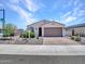Inviting single-story home featuring desert landscaping, a paved driveway, and a well-kept front yard with great curb appeal at 15817 S 177Th Dr, Goodyear, AZ 85338