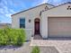 Charming single-story home with a desert landscape, arched entry and a two car garage at 15817 S 177Th Dr, Goodyear, AZ 85338