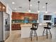 Modern kitchen with stainless appliances, granite countertops, and a backsplash at 15817 S 177Th Dr, Goodyear, AZ 85338