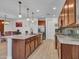Spacious kitchen with stainless steel appliances, a central island, and sleek pendant lighting at 15817 S 177Th Dr, Goodyear, AZ 85338