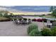 Beautiful lakeside firepit area with comfortable seating and scenic views, perfect for outdoor gatherings and relaxation at 15817 S 177Th Dr, Goodyear, AZ 85338