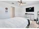 Serene main bedroom features a ceiling fan, TV, and white bedding creating a calm, inviting atmosphere at 15817 S 177Th Dr, Goodyear, AZ 85338