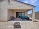 Covered patio area featuring comfortable seating and a fire pit, perfect for outdoor enjoyment at 15817 S 177Th Dr, Goodyear, AZ 85338